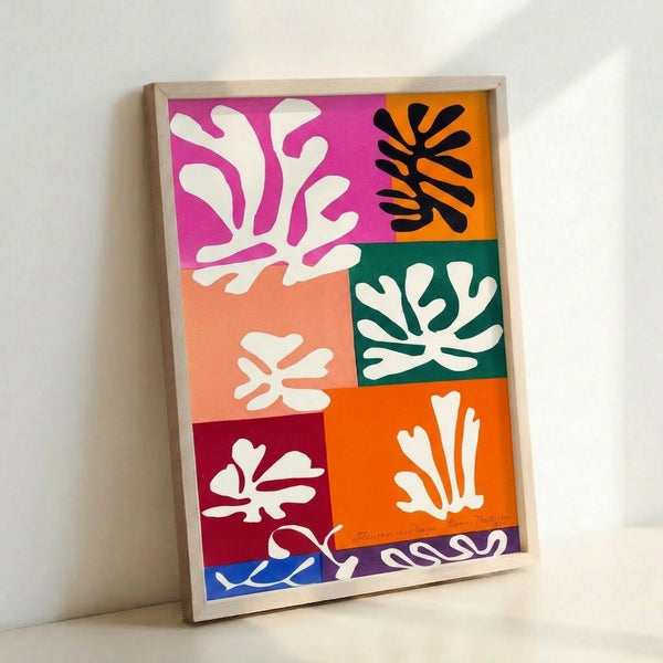 Framed wall art showcasing stylized snow flowers in understated colors with organic, flowing shapes in a modern minimalist composition.