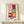 Minimalist wall art featuring stylized snow flowers rendered as bold, colorful geometric forms in white, red, blue, and yellow.
