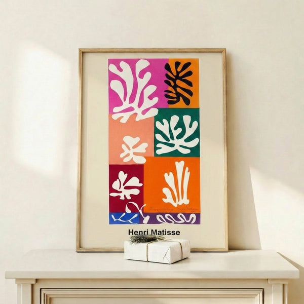 Minimalist wall art featuring stylized snow flowers rendered as bold, colorful geometric forms in white, red, blue, and yellow.