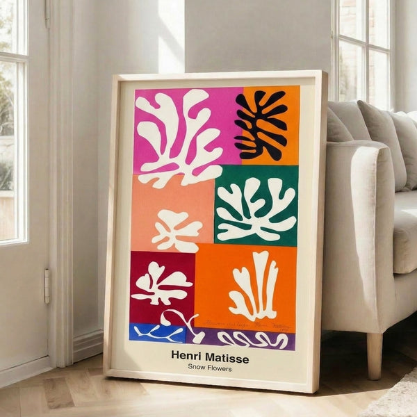 Vibrant abstract floral design with playful cut-out shapes in red, blue, and yellow tones on white, creating a decorative modern art print.