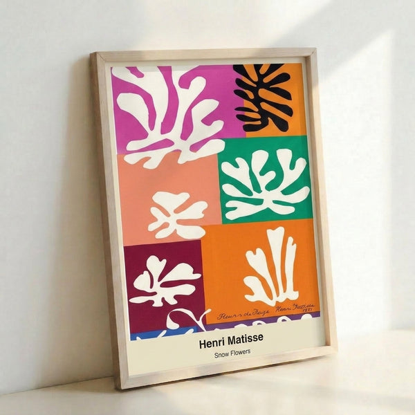 Framed abstract poster displaying delicate snow flower forms in vibrant primary colors against a clean background, reflecting Matisse's signature cut-out aesthetic.