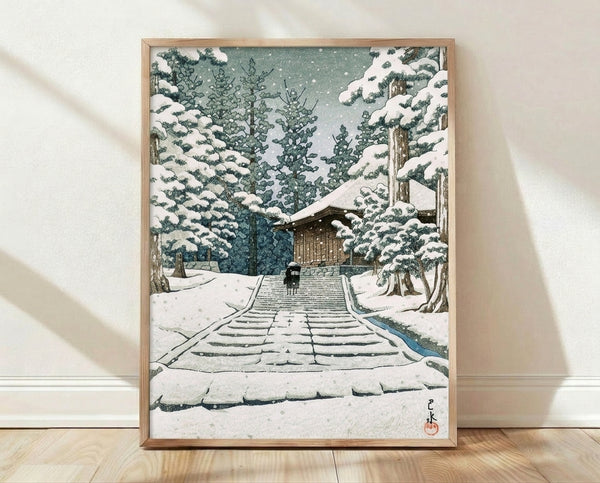 Serene Japanese woodblock print depicting a snow-covered temple stairway winding through a winter forest, with a solitary figure ascending toward the shrine, rendered in soft whites, grays, and forest greens.