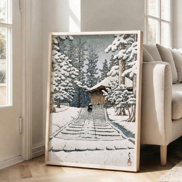 Japandi-style poster art print showcasing a tranquil snow temple scene with descending stairs, solitary visitor, and dense winter forest in muted whites, blue-grays, and deep forest tones.