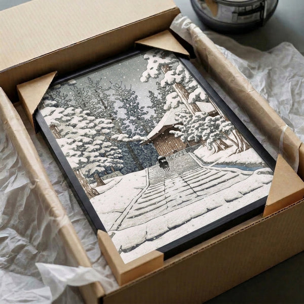 Framed Japanese temple winter print showing peaceful snow-covered stairs ascending through a forested landscape with architectural elements in cool whites, slate grays, and muted forest hues.