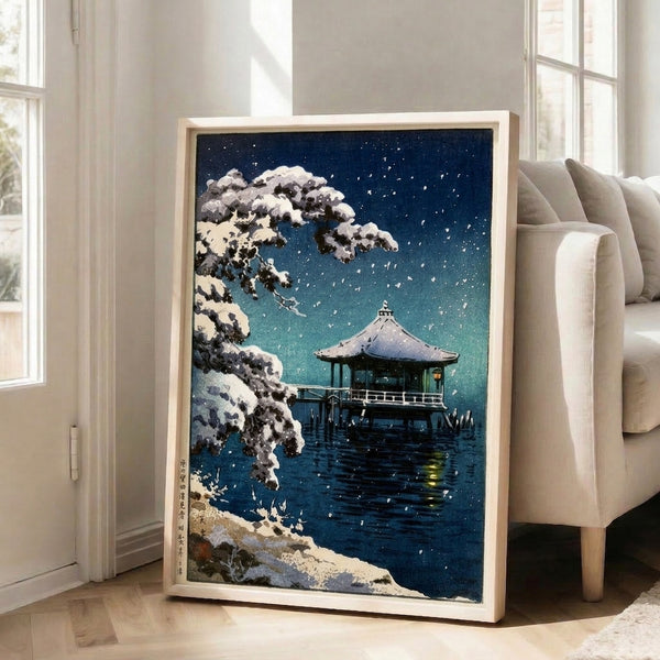 Framed Japanese art print capturing a quiet winter night at a pavilion with starlight, snow, and minimalist composition in navy and cream.