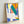 Framed modern art poster with dynamic abstract cutouts in vivid tropical colors evoking the spirit and light of Oceania.