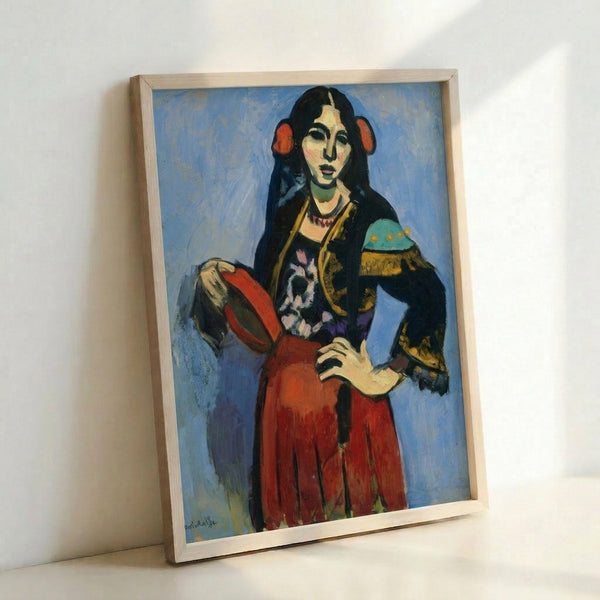 Colorful fauvist art print on a wall showing a Spanish woman playing a tambourine, with dynamic warm and cool tones characteristic of early modern painting.