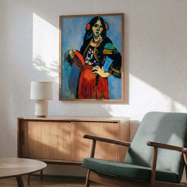Bright contemporary art print on a wall displaying a woman in Spanish attire with a tambourine, painted in energetic fauvist colors and gestural lines.