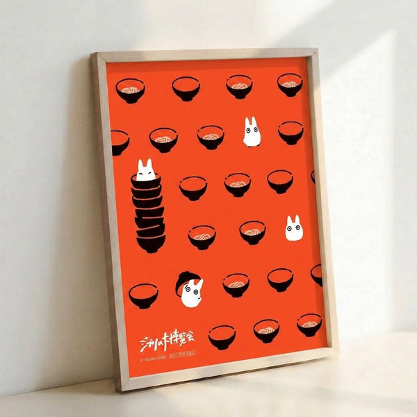 Whimsical anime wall art showing steaming ramen bowls and character spirits in minimalist style, rendered in warm reds and blacks against a light backdrop.