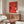 Iconic Studio Ghibli-style poster art showcasing whimsical ramen bowls and fantastical creatures in bold coral red and black, modern minimalist design for home decor.