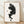 Minimalist black line art poster of whimsical soot sprites from Spirited Away, featuring delicate Ghibli-inspired creatures on cream background, framed on wall.