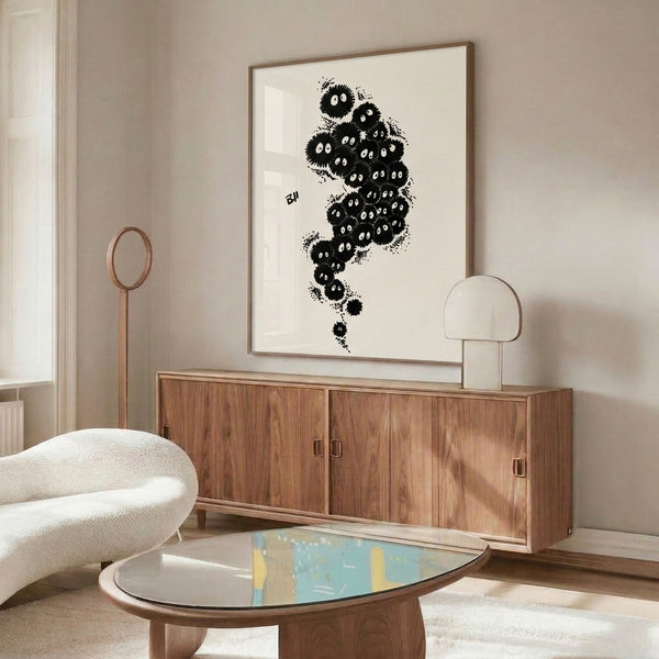 Black line art print featuring mischievous spirit creatures in minimalist Japanese anime style, mounted as wall decor with an enchantingly eerie mood.