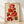 Minimalist line art poster featuring stacked geometric fruit cubes in rust red, burnt orange, and dark green on cream background, creating a fresh and playful kitchen wall display.