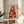Framed abstract fruit poster combining strawberry, lemon, and grapefruit motifs in a minimalist composition of stacked geometric forms in cream, rust, and dark green.