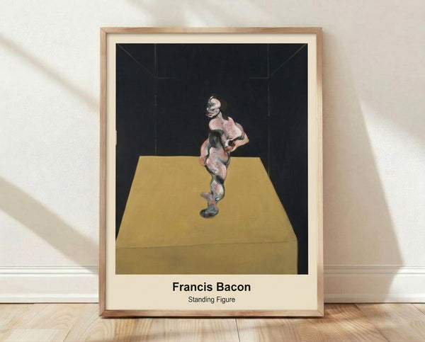 Abstract modern art print depicting a solitary standing figure rendered in muted grays, browns, and blacks with an intensely claustrophobic mood, framed on a wall.