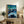 Wall art print featuring an emotionally charged night sky with dynamic curved strokes in deep blues and luminous yellows over a dark landform.