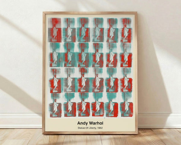 Pop art print of the Statue of Liberty in vibrant red, blue, and yellow on white ground, rendered in bold graphic style with high-contrast silhouette.