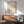 Wall art poster of a contemplative steamed bun bowl with Japanese calligraphy, featuring warm cream and orange-brown hues in Showa woodblock tradition.