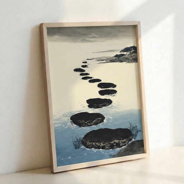 Framed minimalist poster depicting a tranquil coastline with stepping stones in wabi sabi style, soft watercolor washes in gray and blue.