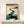 Calm watercolor wall art showing a path of rocks through peaceful waters with sparse vegetation, Japandi-inspired minimalist composition.