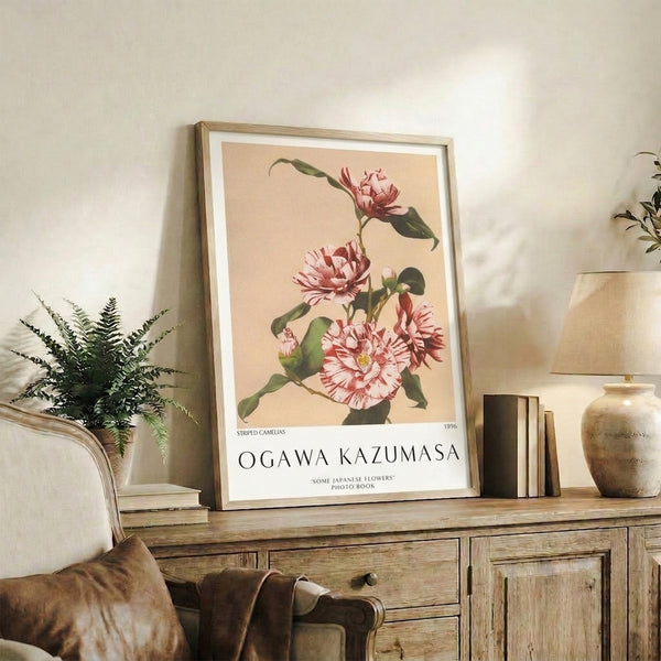 Delicate camelia flower art print in subdued vintage palette combining pale cream background with striped pink and red blooms, refined Japandi wall décor.