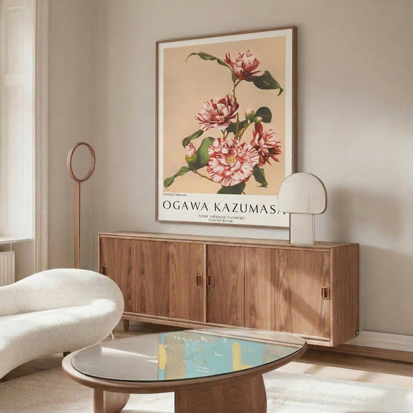Sophisticated floral poster displaying blooming striped camelias with layered petals in rose and crimson tones, pale centers, and serene green foliage in classic vintage style.