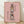 Whimsical Studio Ghibli character totem poster in rose pink, sage green, and charcoal gray, featuring stacked spirits and creatures in a playful anime art style framed on a wall.