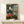 Abstract representation of an artist's workspace with flattened perspective, using ochre, blues, and grays in Matisse's distinctive modernist style.