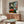 Framed Matisse print of his studio space combining muted palette with bold color accents in a cubist-influenced arrangement of domestic forms.