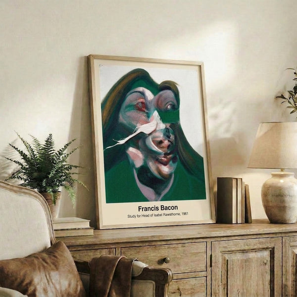 Framed contemporary portrait print featuring distorted head imagery in ochre and black tones, creating an intense and confrontational visual presence.