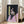 Faceless figure rendered in loose, gestural brushstrokes with warm ochre and cool gray tones, creating an unsettling contemporary portrait study.