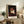 Contemporary wall art featuring a deconstructed papal portrait in cool grays with warm orange undertones, exploring themes of power and anxiety.