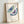 Elegant line drawing poster showcasing two stylized butterflies in teal and purple tones on cream, a minimalist interpretation of nature suitable for contemporary interiors.