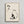 Zen-inspired line art poster with delicate pear and leaf imagery in black ink and rust tones, capturing contemplative mood through minimalist Japanese aesthetic.