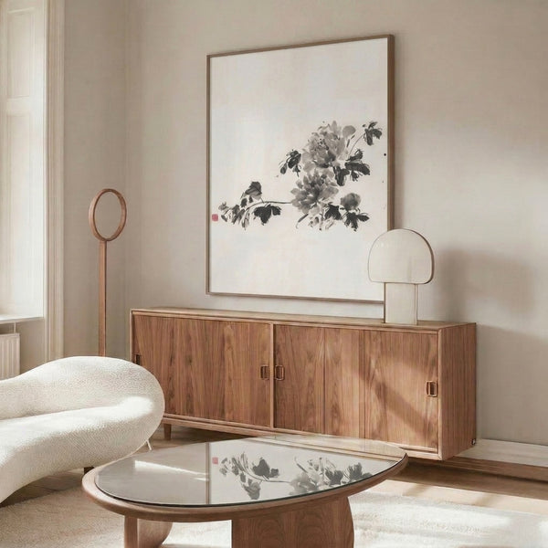 Framed minimalist peony poster featuring delicate sumi-e brushstrokes in black and gray on cream, evoking peaceful Japandi interior aesthetic.