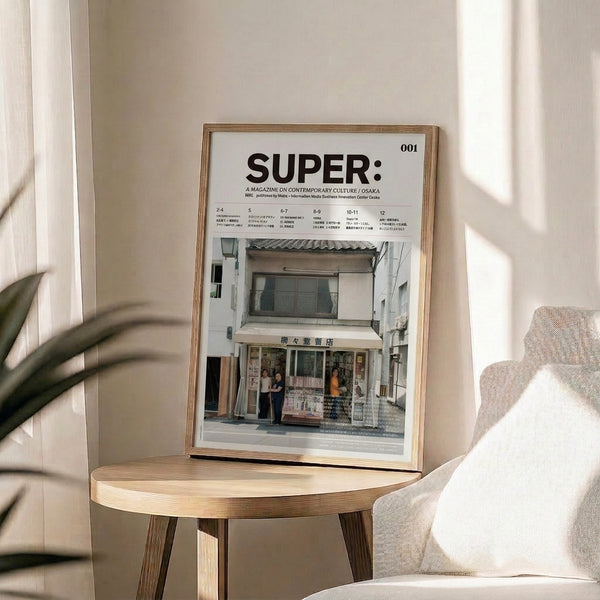 Contemporary wall print showing a bookshop storefront and street life rendered in a minimalist style with a palette of cream, white, and muted natural colors.