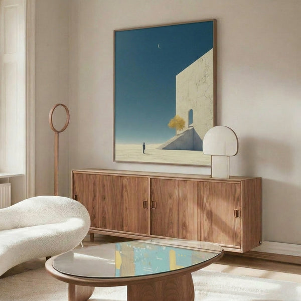 Dreamlike poster art featuring an ascending figure and solitary tree silhouetted against a moon-filled desert with impossible architecture, painted in soft grey, teal, and golden hues.