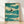 Minimalist Japanese woodblock-style framed poster depicting a swallow in flight over rolling waves, rendered in teal, sage green, and black line art with a serene, meditative mood.