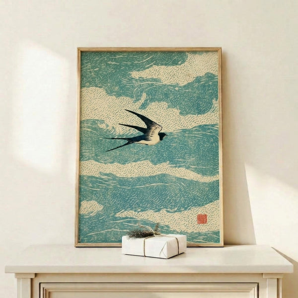 Framed art print of a graceful swallow soaring above water in traditional ukiyo-e aesthetic, featuring bold black linework against cream and teal tones for a peaceful, Zen-inspired look.