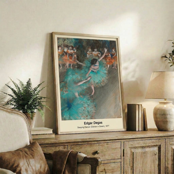 Impressionist ballet scene showing a dancer in flowing green garments with dynamic movement, featuring a soft palette of ochre, pastel blue, and cream in this elegant poster print.