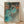 Framed poster of a graceful ballerina in a flowing green dress, captured in a moment of fluid movement with soft, impressionistic brushstrokes in muted tones.