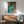 Impressionistic poster featuring a dancer in an iridescent green dress caught mid-movement, rendered with soft brushwork and a peaceful, dreamy aesthetic.
