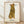 Pop art framed poster of a tabby cat in Warhol style, rendered in warm gold, soft orange, cream, and black tones with whimsical, nostalgic character.