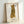 Modern pop art print of a tabby cat displayed framed on wall, capturing vintage charm with warm golden tones and a whimsical, affectionate mood.