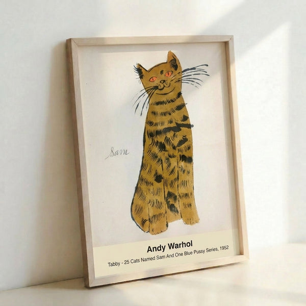 Modern pop art print of a tabby cat displayed framed on wall, capturing vintage charm with warm golden tones and a whimsical, affectionate mood.