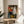 Constructivist-style human form composed of angular shapes and limited color palette of black, red, and off-white, framed for interior display.