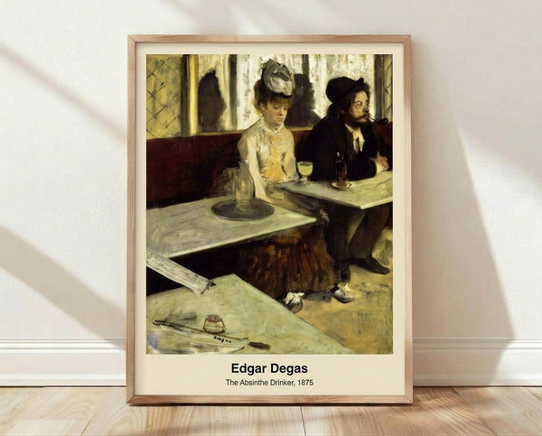 Impressionist framed poster of a solitary woman seated at a café table with an absinthe glass, rendered in muted greens and ochres with a melancholic mood.