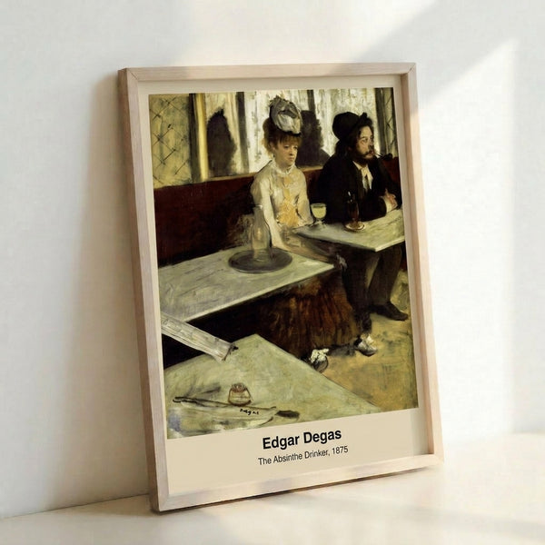 Framed Impressionist artwork depicting a seated woman with absinthe, featuring muted earth tones and a somber, introspective mood.