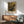 Soft impressionist composition of ballet dancers in cream, ochre, and pale blue, capturing the grace and introspection of a studio rehearsal as wall decor.