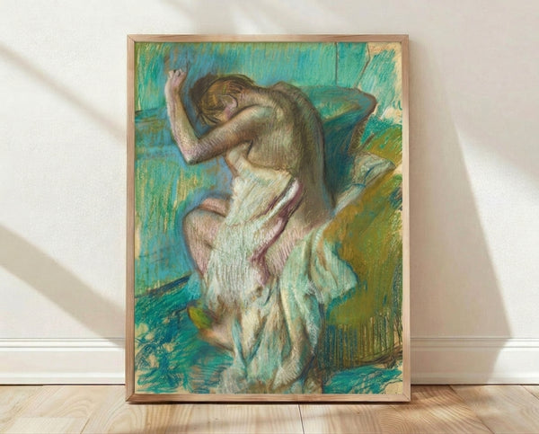 Impressionist painting of a woman bathing, rendered in soft pastels and muted tones of blue, pink, and cream, framed as a poster on a wall.